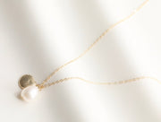 Shell with Baroque Pearl Necklace
